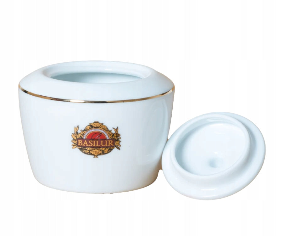 Otwarta porcelanowa cukiernica Basilur 325 ml z logo i złotym rantem.