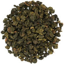 Susz herbaty Basilur White Magic – liście mlecznej oolong o zielonej barwie.