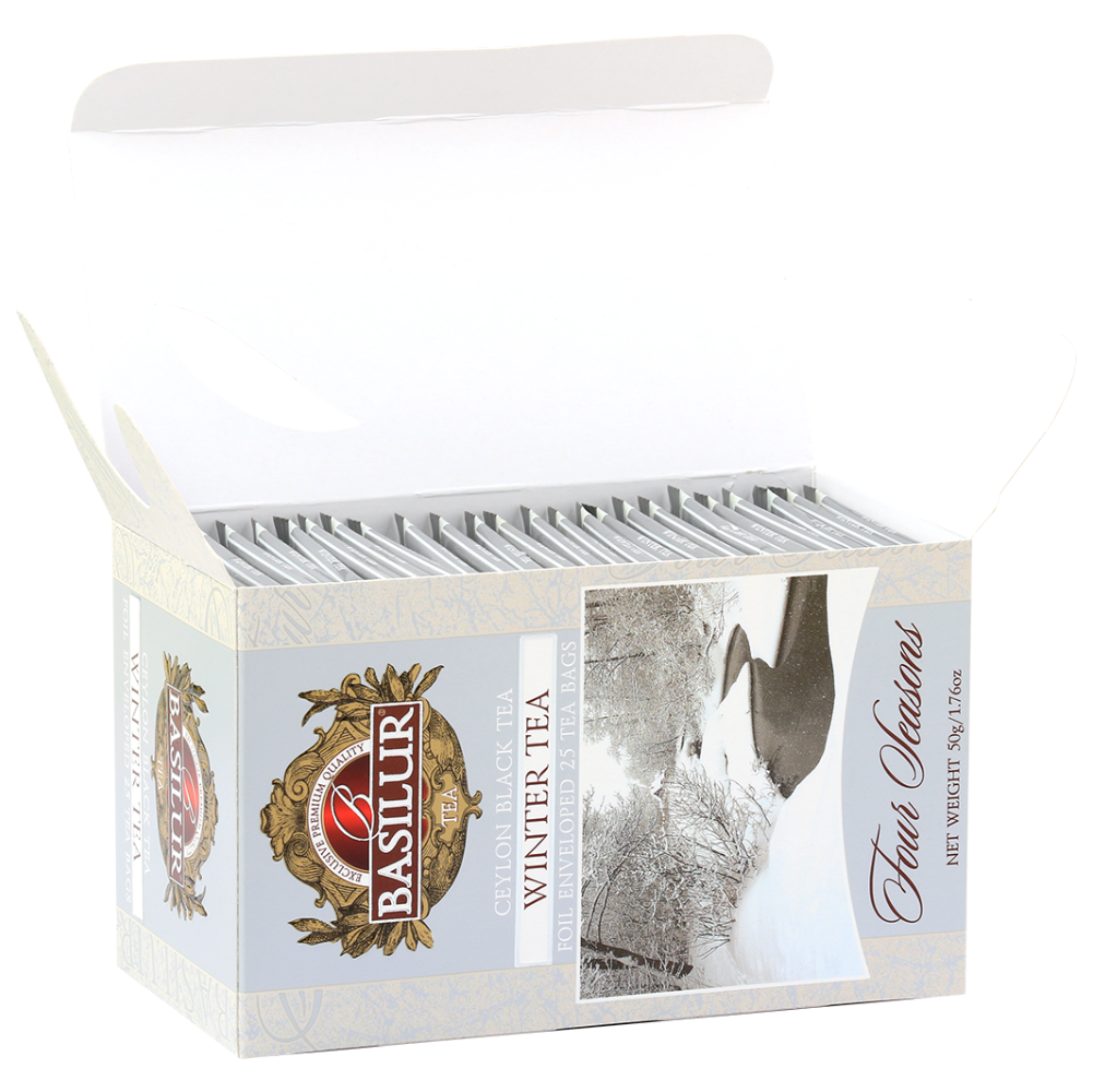 Otwarte pudełko Basilur Winter Tea z widocznymi kopertami herbaty w środku.