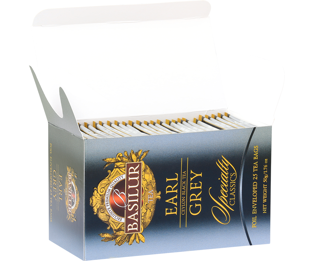 Otwarte pudełko herbaty Basilur Earl Grey z widocznymi kopertami z torebkami herbaty, klasyczna czarna herbata cejlońska z bergamotką.