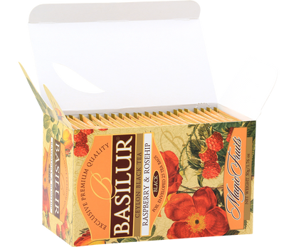 Otwarte pudełko herbaty Basilur Raspberry & Rosehip z widocznymi saszetkami.