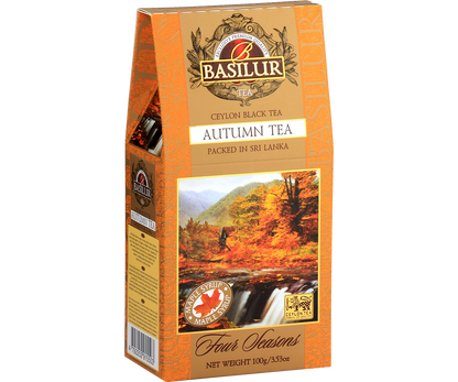 Czarna herbata Basilur Autumn Tea w złoto-pomarańczowym opakowaniu – widok z przodu.