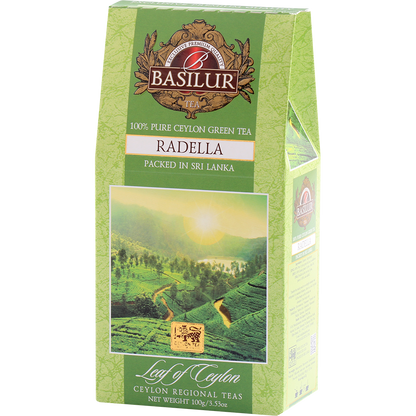 Zielone opakowanie herbaty Basilur Radella Green z górskim krajobrazem Cejlonu.