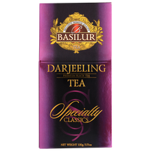 Przód opakowania Basilur Darjeeling w fioletowo-złotej tonacji.