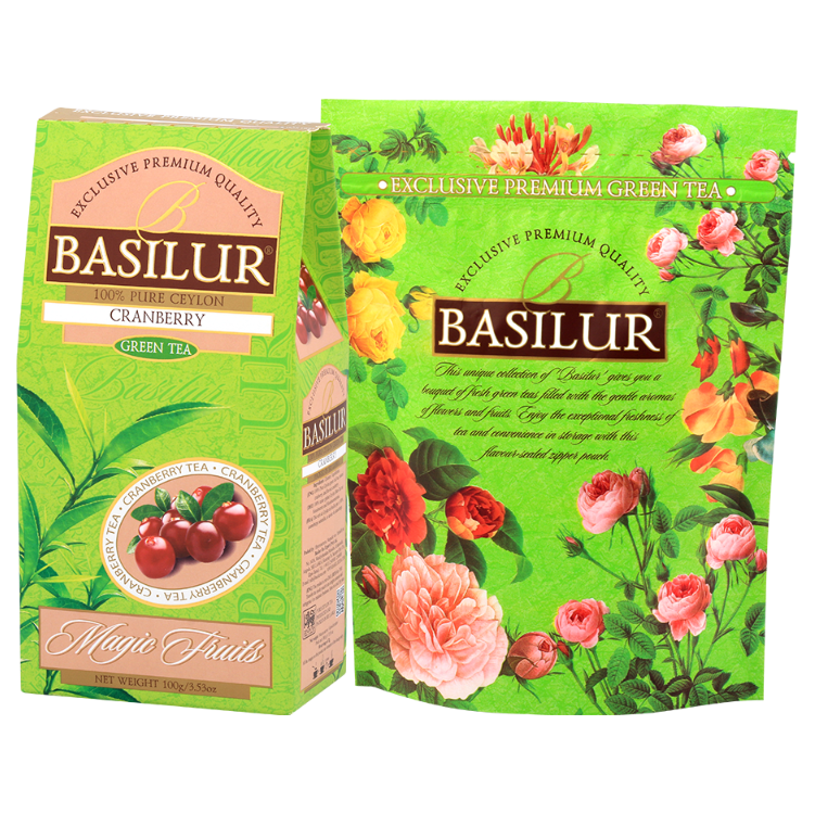 Herbata zielona Basilur Cranberry z żurawiną w opakowaniu z kolekcji Magic Fruits na tle kwiatowej grafiki Basilur.