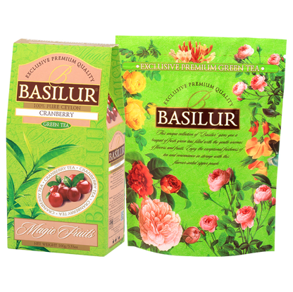 Herbata zielona Basilur Cranberry z żurawiną w opakowaniu z kolekcji Magic Fruits na tle kwiatowej grafiki Basilur.
