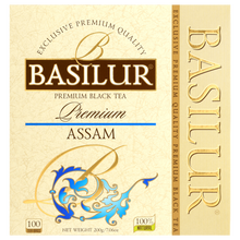 Front pudełka Basilur Assam z logo i złoto-niebieskimi zdobieniami