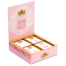 Zestaw herbat Basilur Pink Tea Collection w otwartym pudełku z widocznymi czterema smakami.