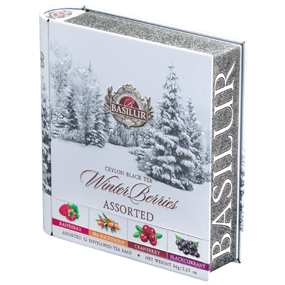 Puszka w kształcie książki Basilur Winter Berries z zimowym motywem.
