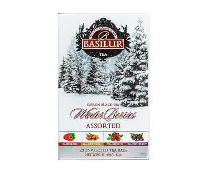 Herbata Basilur Winter Berries w zimowym opakowaniu z ilustracją ośnieżonych drzew.