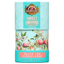 Herbata zielona Basilur Peach & Elderflower w ozdobnej turkusowej tubie z motywem brzoskwiń i kwiatów.