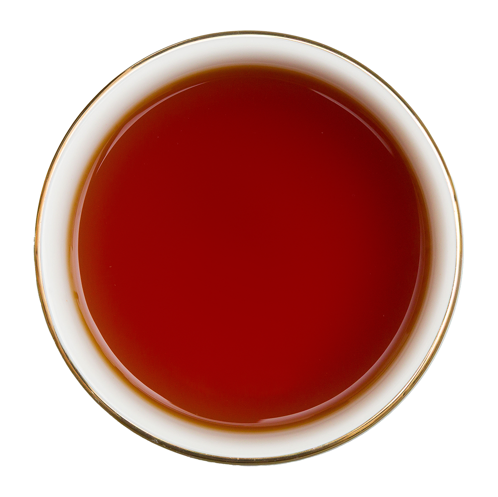 Czerwono-bursztynowy napar z czarnej herbaty Basilur Crimson Red z mango i wiśnią