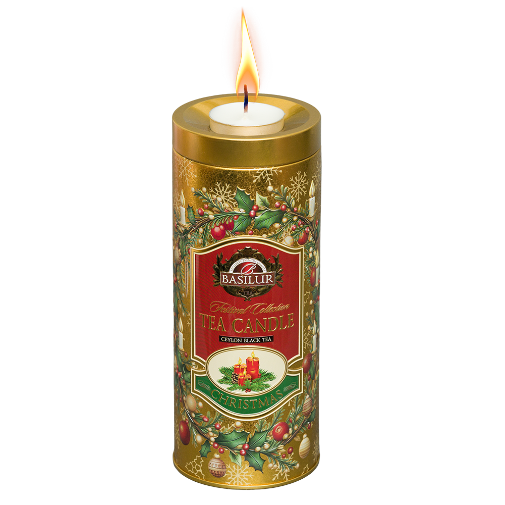 Herbata czarna Basilur Gold Edition w świątecznej złotej puszce z zapaloną świeczką tealight na wieczku.