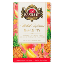 Herbata ziołowa Basilur Immunity z kurkumą, mango i ananasem, opakowanie 20 saszetek widoczne z przodu.