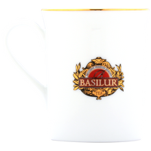 Elegancki porcelanowy kubek Basilur z logo i złotym rantem.
