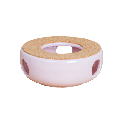 Ceramiczny podgrzewacz do herbaty w kolorze różowym z otworami bocznymi widok z boku