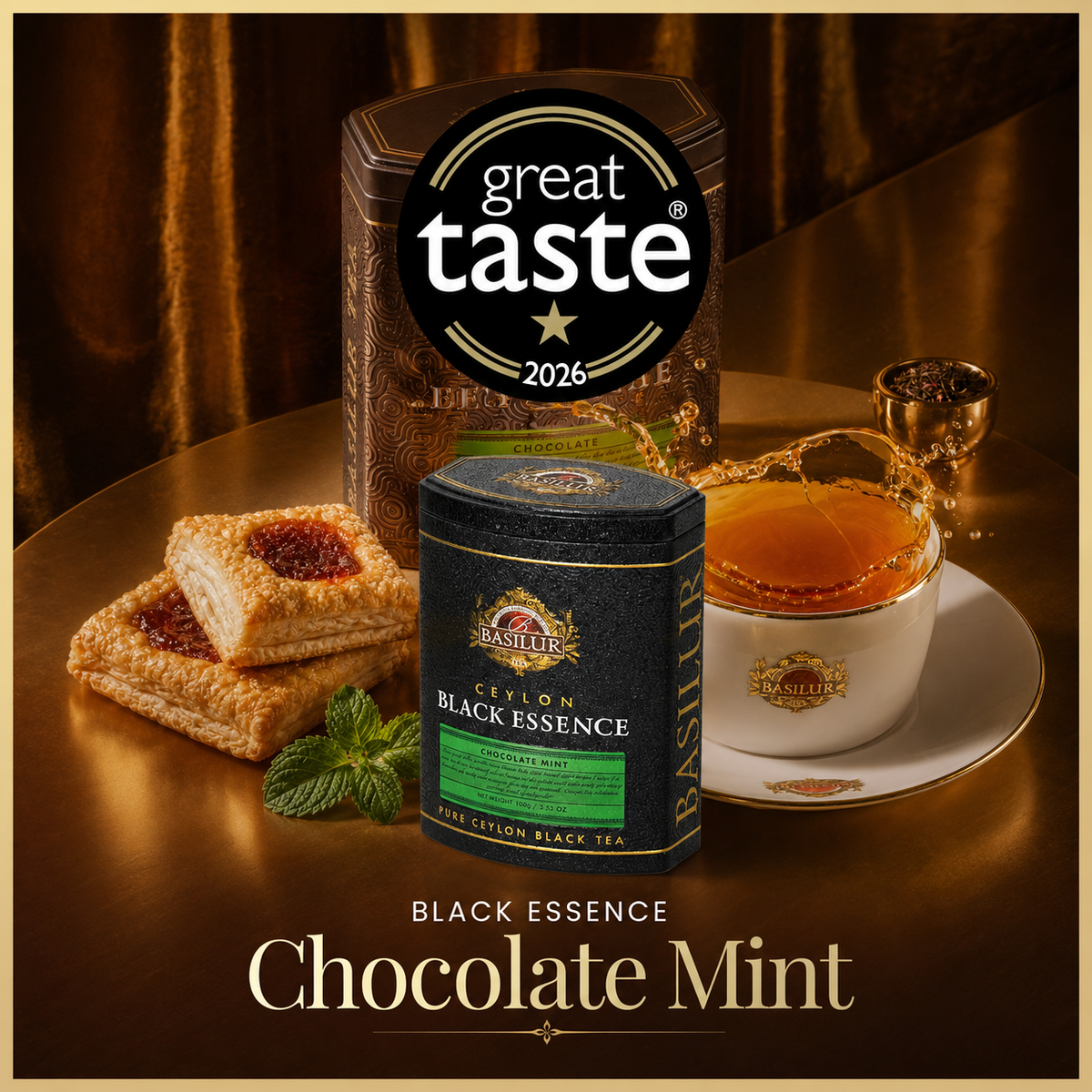 Herbata Basilur Chocolate Mint w ozdobnych puszkach, z filiżanką herbaty i ciastkami, oznaczenie Great Taste 2026