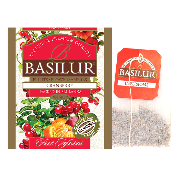Saszetka herbaty Basilur Cranberry oraz torebka z naparem – owocowa herbata bez kofeiny.