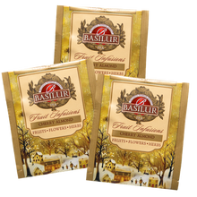 Torebki herbaty Basilur Cherry Almond – pojedyncze koperty z grafiką zimowego miasteczka i logo Basilur.