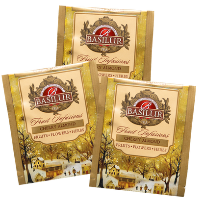 Torebki herbaty Basilur Cherry Almond – pojedyncze koperty z grafiką zimowego miasteczka i logo Basilur.