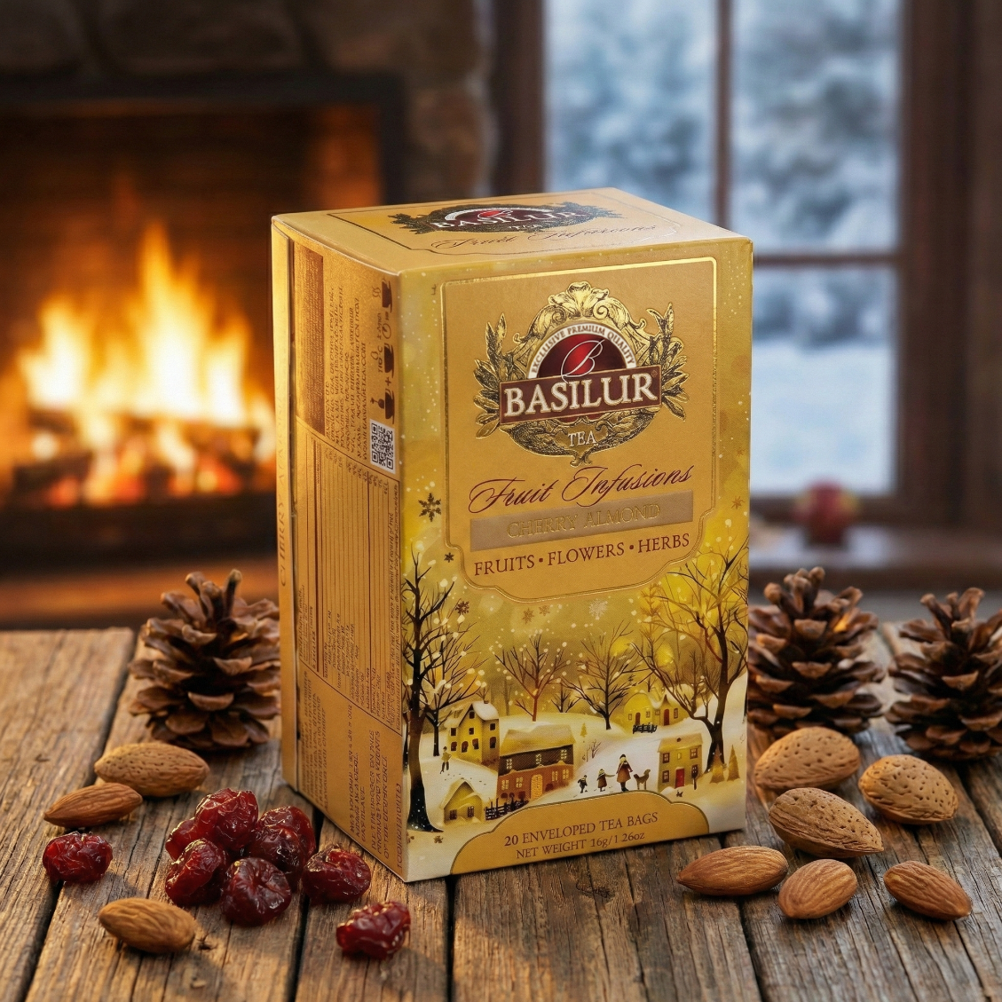 Opakowanie herbaty Basilur Cherry Almond na drewnianym stole, obok migdałów, suszonych wiśni i szyszek, w tle kominek.
